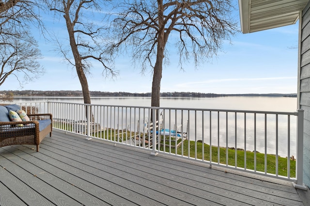 wooden deck with a water view