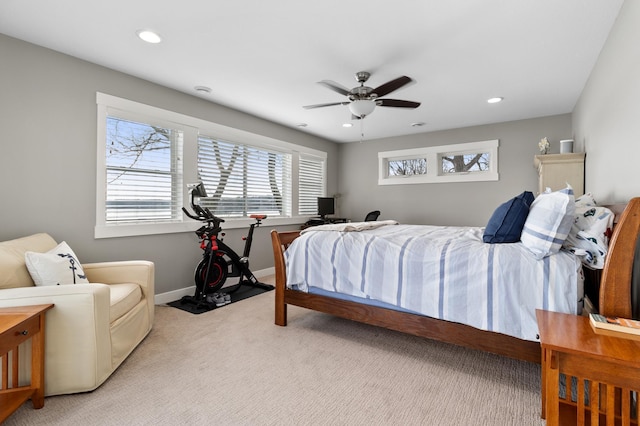 bedroom featuring light carpet, ceiling fan, baseboards, and recessed lighting