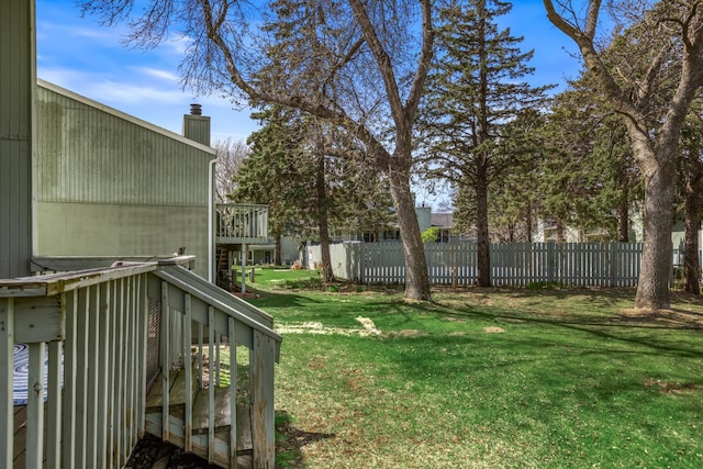 view of yard with fence and a wooden deck