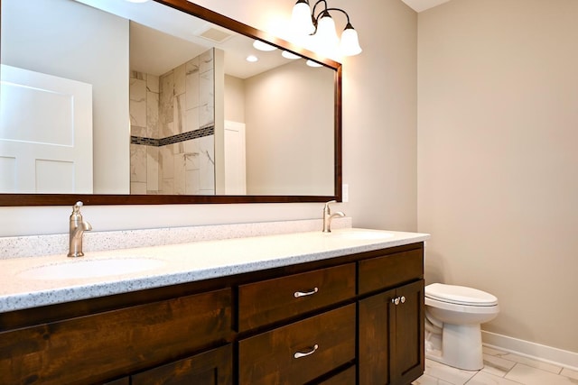 633 Manheim Ave, Saint Charles, MN 55972 - bathroom featuring double vanity, toilet, baseboards, and a shower