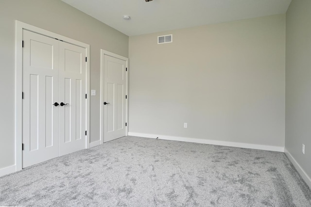 633 Manheim Ave, Saint Charles, MN 55972 - unfurnished bedroom featuring carpet flooring, baseboards, and a closet