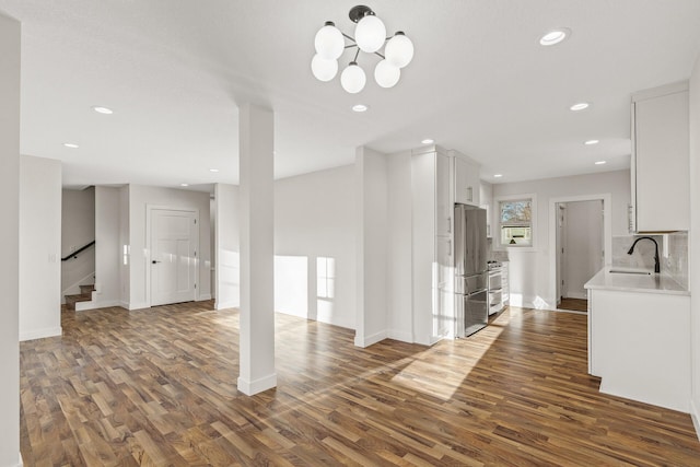2308 Shadywood Rd, Orono, MN 55391 - unfurnished living room with a sink, dark wood-style floors, stairway, baseboards, and recessed lighting