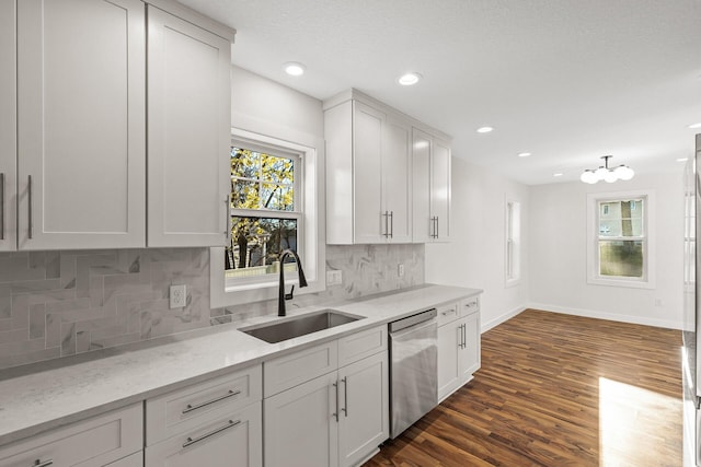 2308 Shadywood Rd, Orono, MN 55391 - kitchen featuring stainless steel dishwasher, a sink, plenty of natural light, baseboards, and recessed lighting