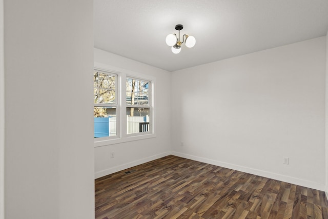 2308 Shadywood Rd, Orono, MN 55391 - unfurnished room with dark wood-style flooring, a chandelier, and baseboards