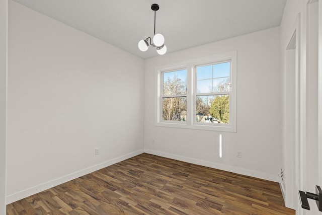 2308 Shadywood Rd, Orono, MN 55391 - unfurnished room featuring baseboards, a chandelier, and dark wood-style floors