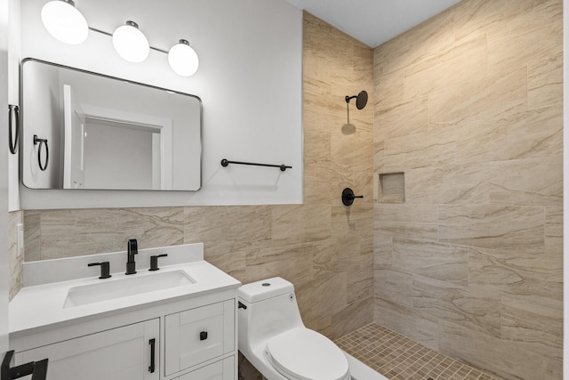 2308 Shadywood Rd, Orono, MN 55391 - full bathroom with tiled shower, vanity, toilet, and tile walls