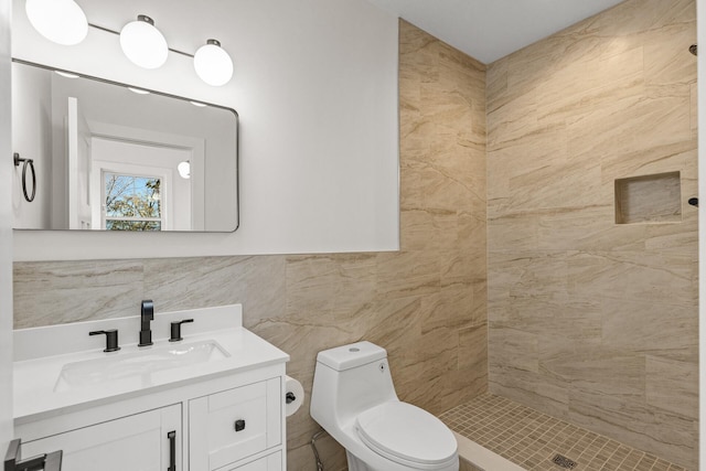 2308 Shadywood Rd, Orono, MN 55391 - full bath featuring toilet, tiled shower, vanity, and tile walls