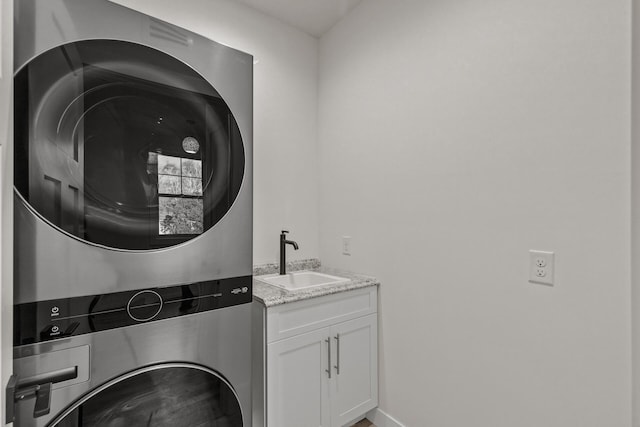2308 Shadywood Rd, Orono, MN 55391 - clothes washing area with stacked washer and clothes dryer and cabinet space