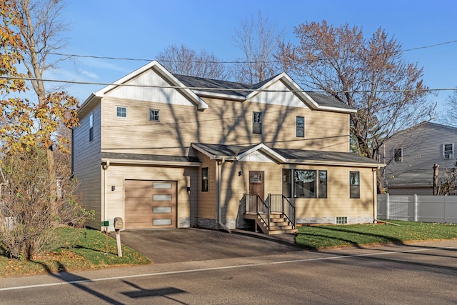 2308 Shadywood Rd, Orono, MN 55391 - traditional home featuring an attached garage and asphalt driveway