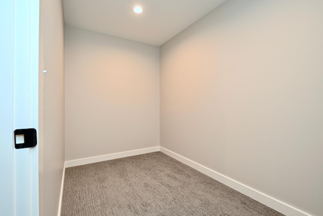 carpeted spare room featuring recessed lighting and baseboards
