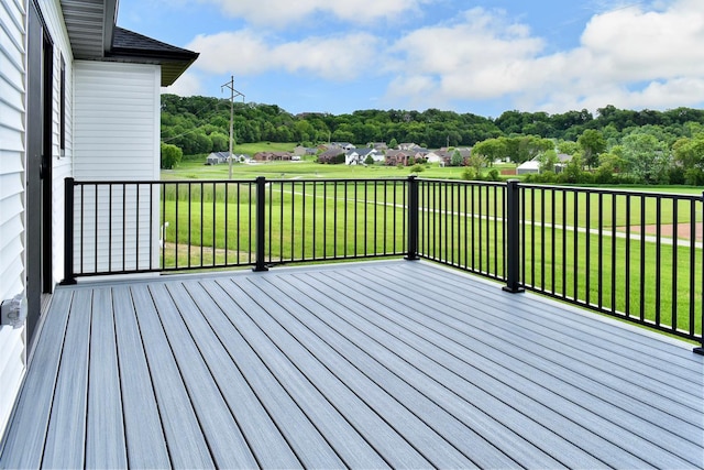wooden terrace with a yard