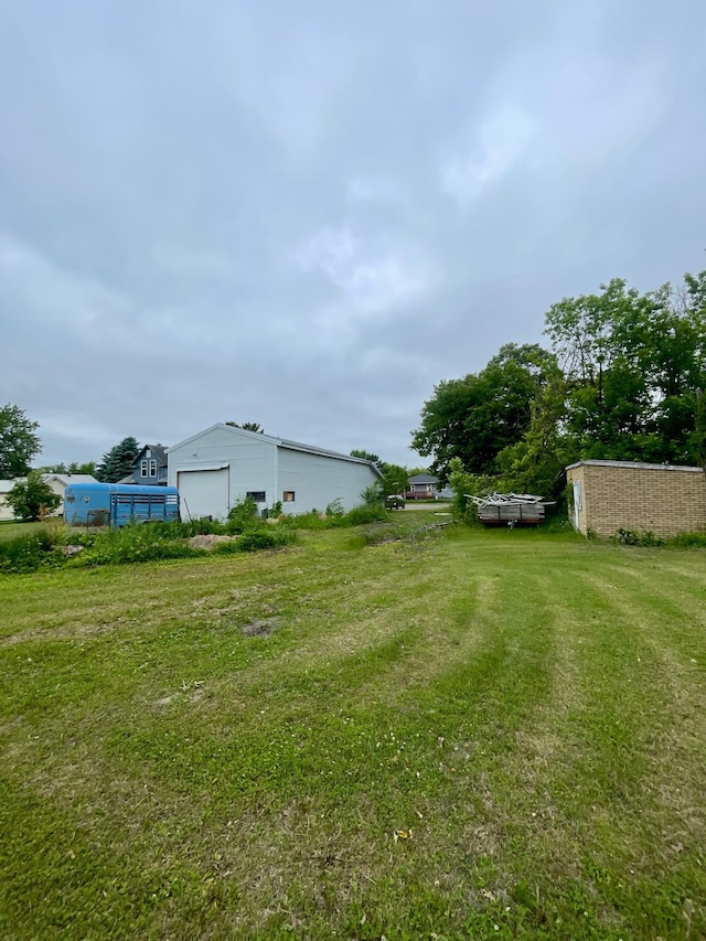 320 8th St SE, Staples, MN 56479 - view of grassy yard with an outdoor structure