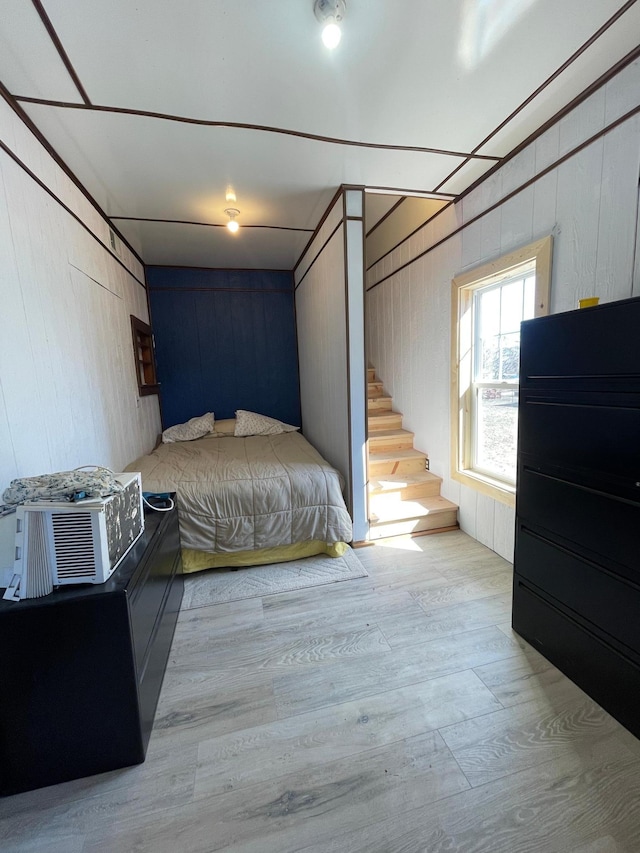 320 8th St SE, Staples, MN 56479 - bedroom with wood finished floors and wood walls