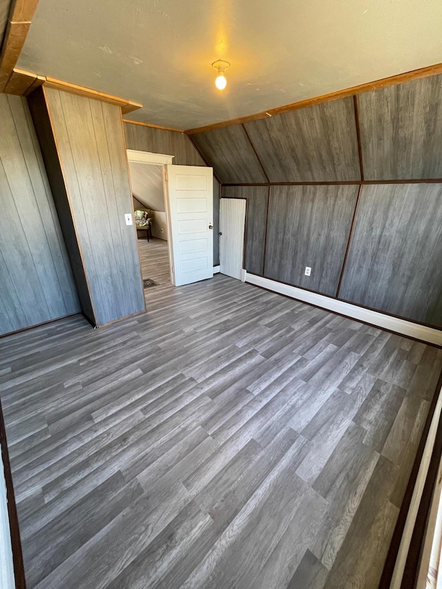 320 8th St SE, Staples, MN 56479 - additional living space featuring wood finished floors, lofted ceiling, and wood walls