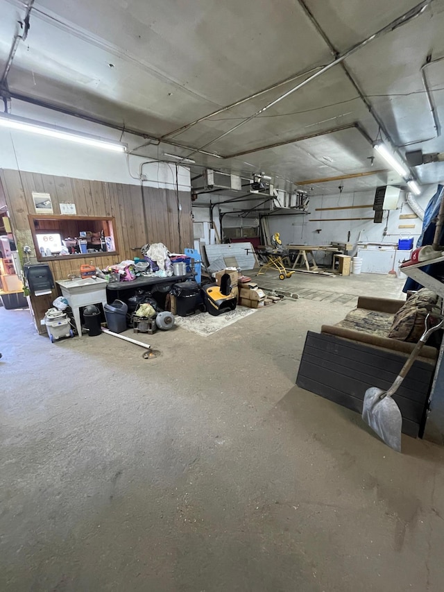 320 8th St SE, Staples, MN 56479 - garage featuring a garage door opener and wooden walls