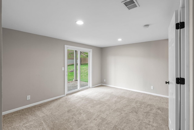 unfurnished room featuring visible vents, baseboards, and carpet floors