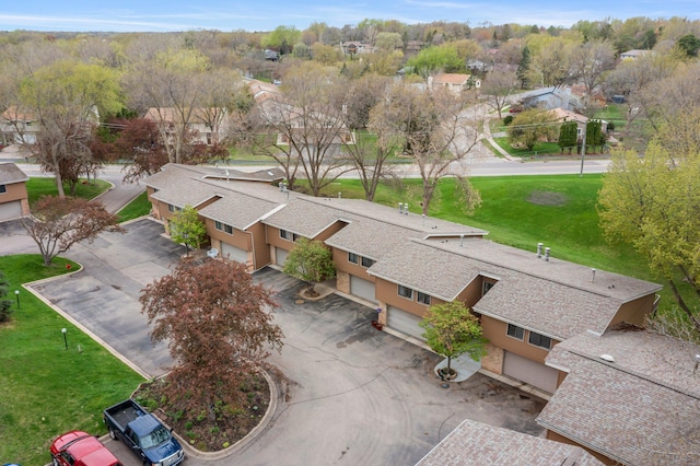 birds eye view of property with a residential view