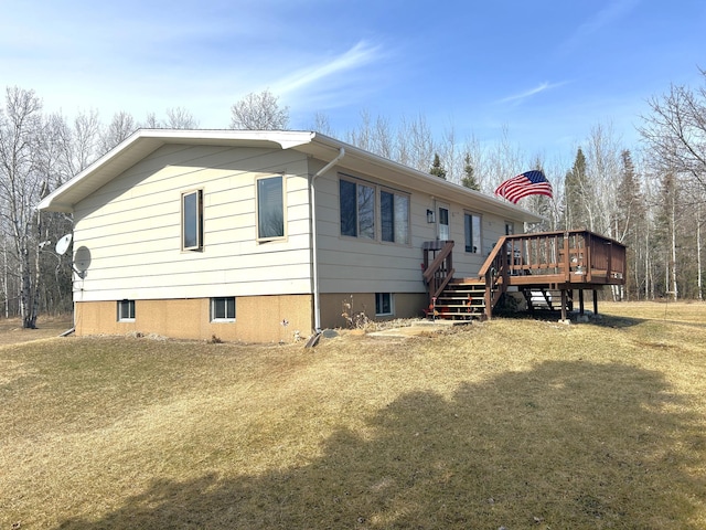 43475 310th Ave NE, Gatzke, MN 56724 - view of side of home featuring a lawn and a deck
