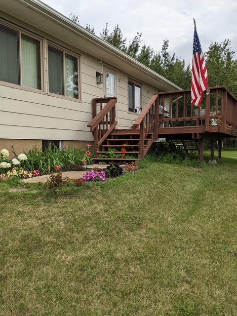 43475 310th Ave NE, Gatzke, MN 56724 - property entrance featuring a yard and a wooden deck