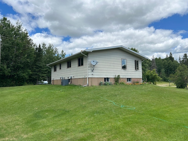 43475 310th Ave NE, Gatzke, MN 56724 - view of side of property with central air condition unit and a yard