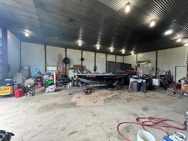 43475 310th Ave NE, Gatzke, MN 56724 - garage featuring a workshop area and metal wall