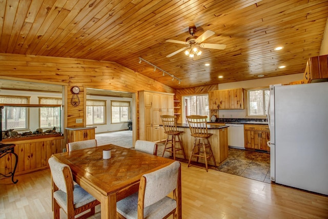 dining space with wood ceiling, ceiling fan, lofted ceiling, and a wealth of natural light
