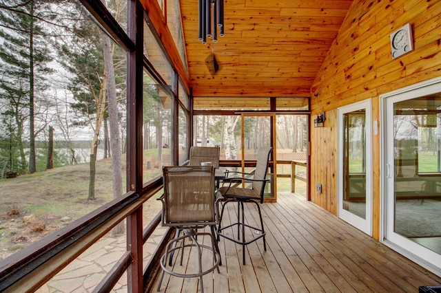 sunroom featuring a wealth of natural light and outdoor dining space