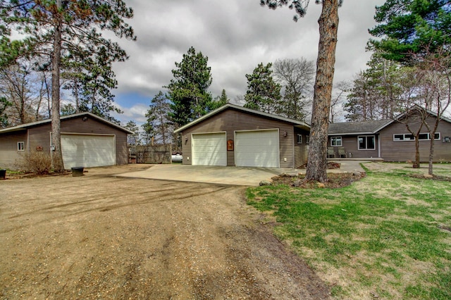 view of front of house with an outbuilding and a garage
