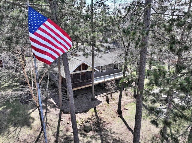 back of house featuring a deck