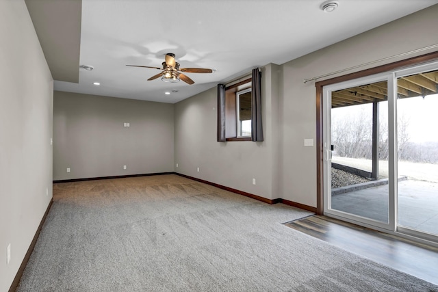 spare room with a wealth of natural light, baseboards, ceiling fan, and carpet flooring