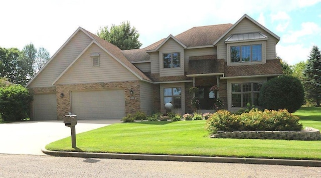 853 Franklin Ave SW, Wadena, MN 56482 - view of front of house featuring a front yard, concrete driveway, brick siding, a shingled roof, and an attached garage