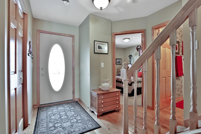 29561 Mentzer Ct, Lindstrom, MN 55045 - foyer entrance with stairs, light wood-type flooring, and baseboards