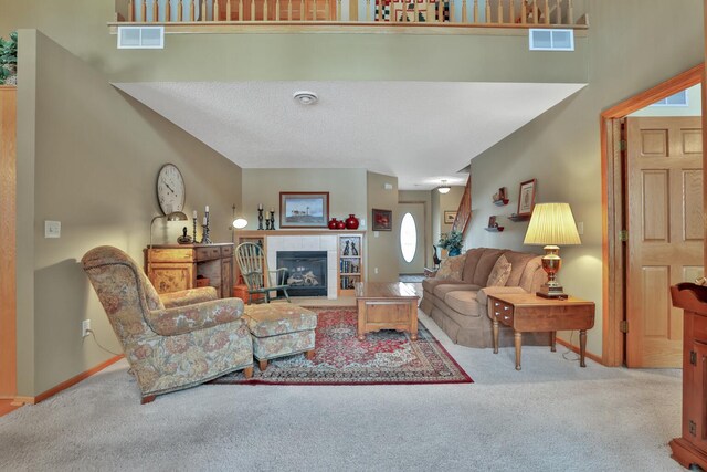 29561 Mentzer Ct, Lindstrom, MN 55045 - carpeted living room featuring a tile fireplace and baseboards