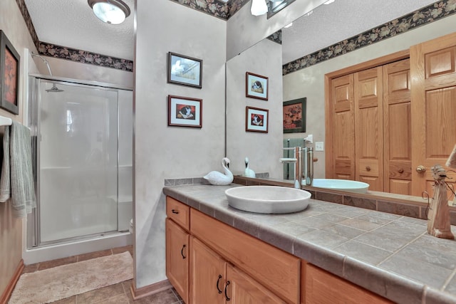 29561 Mentzer Ct, Lindstrom, MN 55045 - full bath featuring a textured ceiling, a stall shower, and vanity