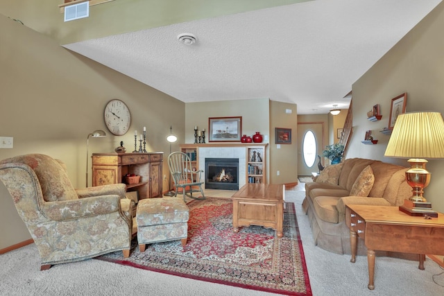 29561 Mentzer Ct, Lindstrom, MN 55045 - living room featuring carpet flooring, a tile fireplace, and a textured ceiling