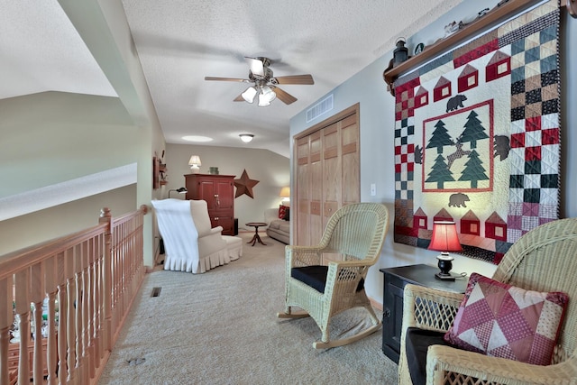 29561 Mentzer Ct, Lindstrom, MN 55045 - sitting room with carpet flooring, a ceiling fan, a textured ceiling, and vaulted ceiling
