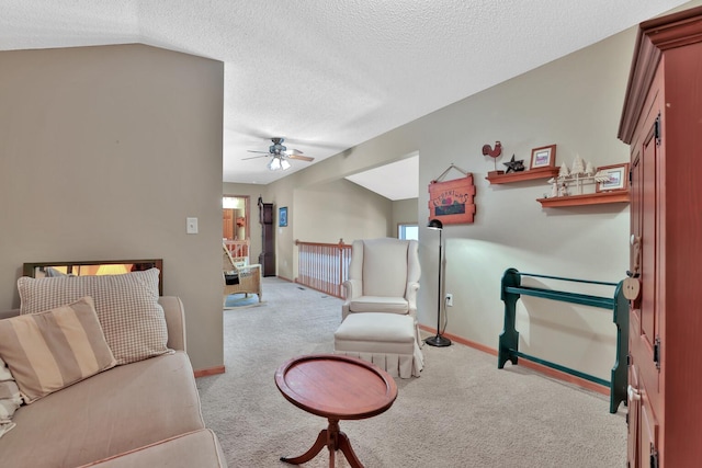 29561 Mentzer Ct, Lindstrom, MN 55045 - carpeted living area featuring a ceiling fan, a textured ceiling, and baseboards