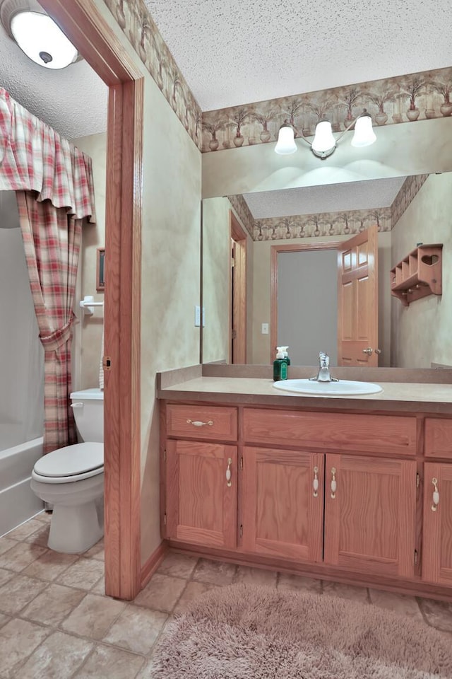 29561 Mentzer Ct, Lindstrom, MN 55045 - bathroom featuring vanity, toilet, shower / bath combo, a textured ceiling, and stone finish flooring