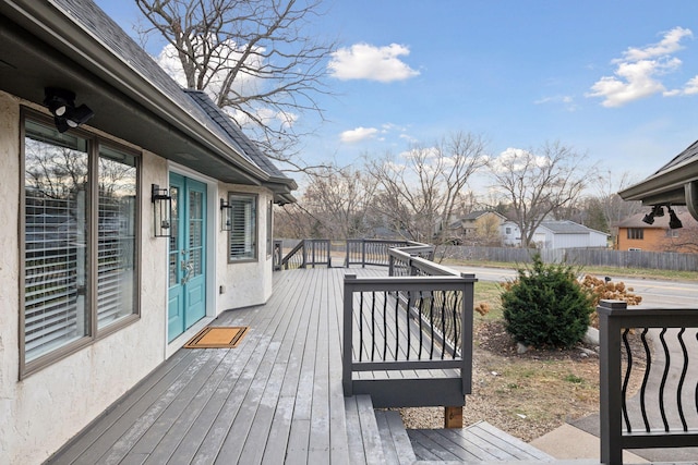 deck featuring a residential view and fence