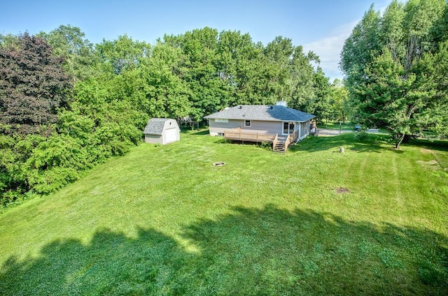 620 Callahan Pl, Mendota Heights, MN 55118 - view of green lawn with a wooden deck, a shed, and a view of trees