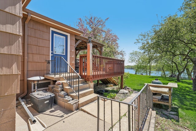 16139 Northwood Rd NW, Prior Lake, MN 55372 - entrance to property featuring a lawn and a deck with water view