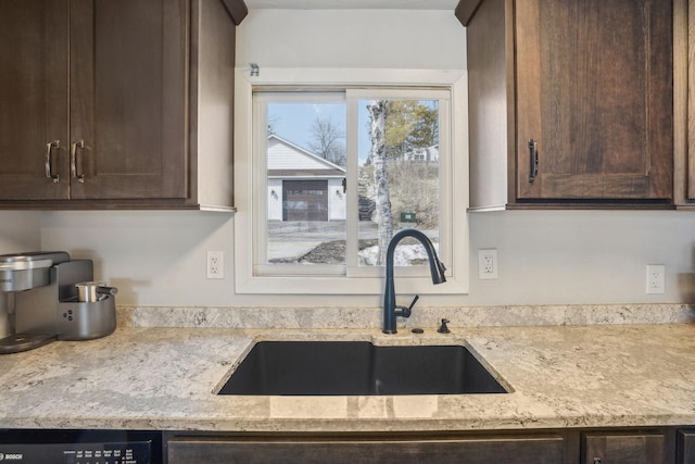 16139 Northwood Rd NW, Prior Lake, MN 55372 - kitchen featuring a sink, dark brown cabinetry, light stone counters, and dishwasher