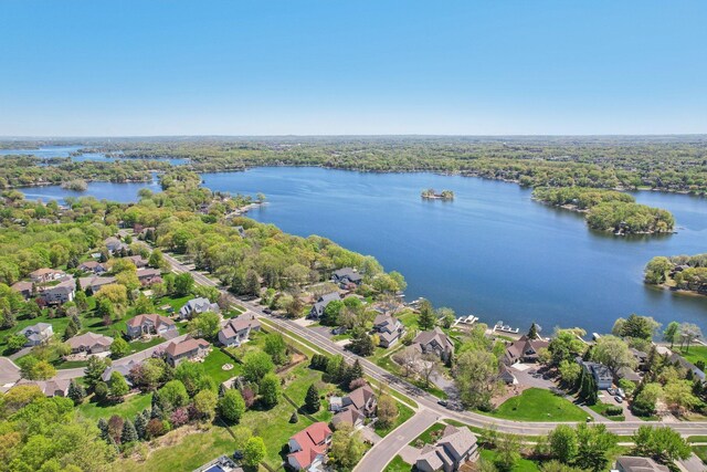 16139 Northwood Rd NW, Prior Lake, MN 55372 - aerial view of residential area featuring a nearby body of water and a heavily wooded area