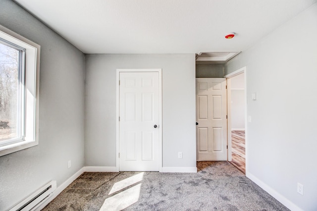 33916 Twin Oaks Loop, Motley, MN 56466 - unfurnished bedroom with baseboard heating, carpet, and baseboards