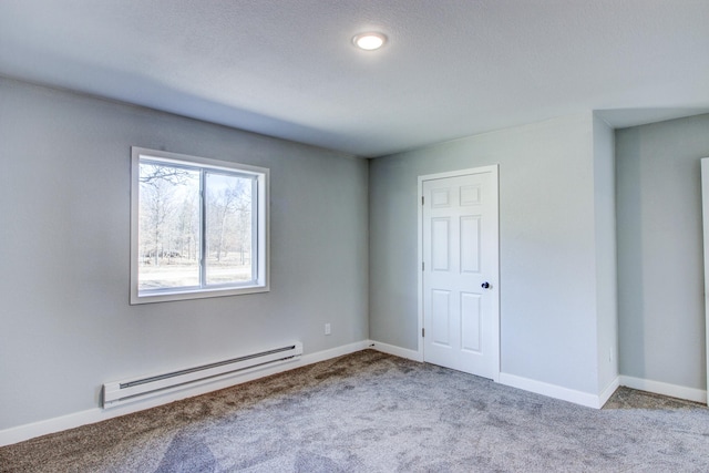 33916 Twin Oaks Loop, Motley, MN 56466 - spare room featuring a baseboard radiator, carpet floors, and baseboards