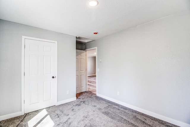 33916 Twin Oaks Loop, Motley, MN 56466 - unfurnished bedroom featuring baseboards and carpet floors