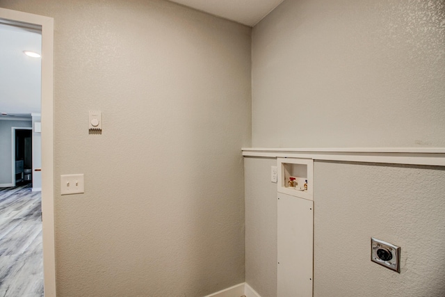 33916 Twin Oaks Loop, Motley, MN 56466 - laundry area featuring electric dryer hookup, wood finished floors, washer hookup, and baseboards