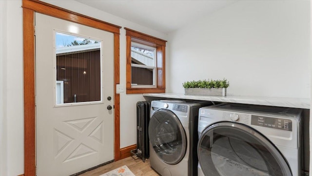 741 Riverside Rd, Holdingford, MN 56340 - laundry room with independent washer and dryer, light wood finished floors, and baseboards