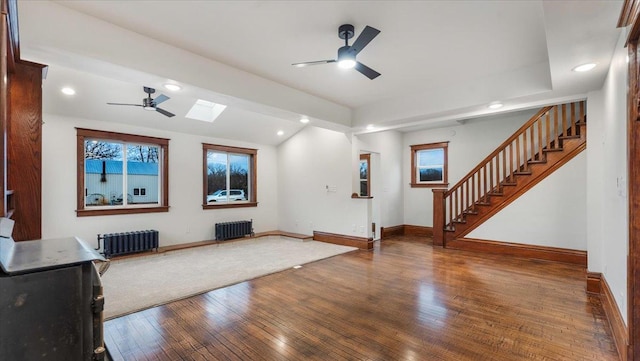 741 Riverside Rd, Holdingford, MN 56340 - cinema featuring radiator heating unit, ceiling fan, a skylight, hardwood / wood-style floors, and recessed lighting