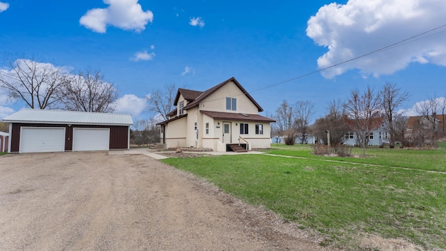 741 Riverside Rd, Holdingford, MN 56340 - view of front of property featuring an outdoor structure, a detached garage, and a front yard